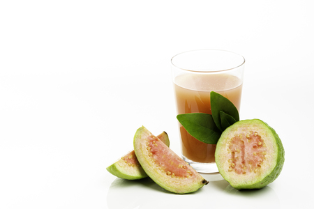 Guava juice and peeled fruit on white background.の写真素材