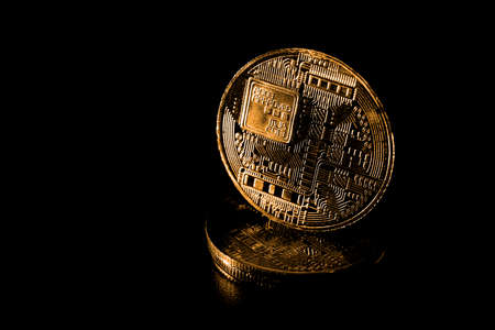 Various physical metal coins scattered over black background. Cryptocurrency concepts.の写真素材