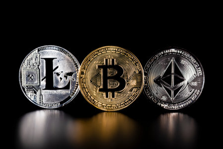 Various physical metal coins scattered over black background. Cryptocurrency concepts.