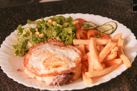 Executive plate of fries and steak with eggsの写真素材