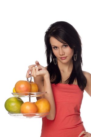 beautiful brunette with citrus on a white backgroundの写真素材