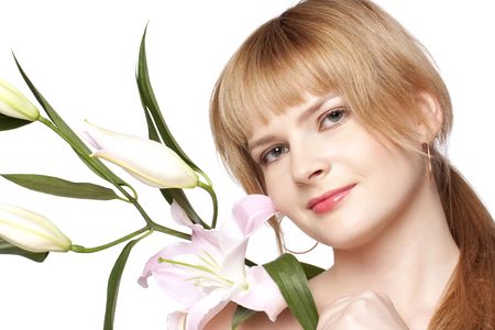 beautiful woman with a lily flower on a white backgroundの写真素材