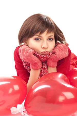 girl with red heart balloon on a white backgroundの写真素材