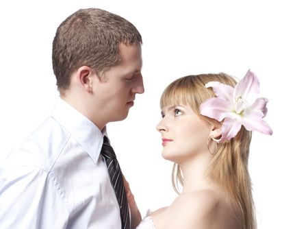 Newly married man and the woman with a pink lilyの写真素材