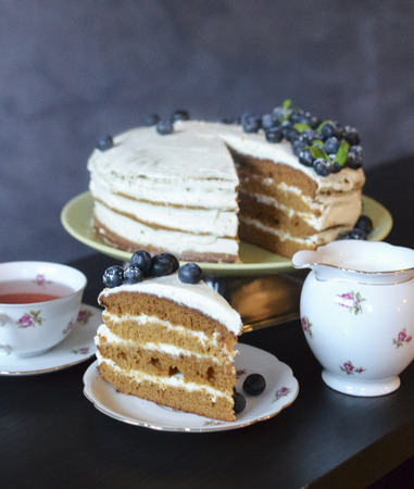 Cutted white cake with blueberriesの写真素材