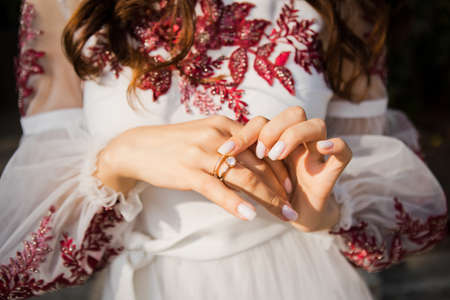 Close up of an elegant diamond ring soft and selective focus. Close up of an elegant diamond ring on the woman's finger. love and wedding concept.の写真素材