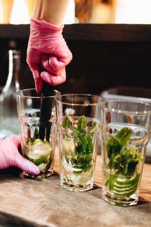 Young girl preparing mojito cocktailの写真素材