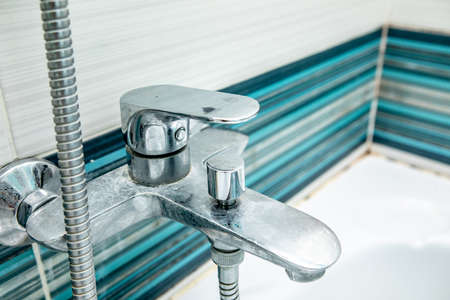 Bathroom mixer old dirty in plaque and rust, covered with condensate.の写真素材