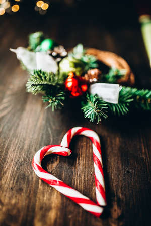 Christmas set of fir branches ornaments and lollipopsの写真素材