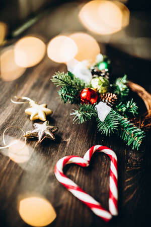 Christmas set of fir branches ornaments and lollipopsの写真素材