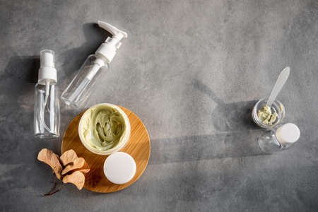 Set of empty jars for cosmetics on a gray background. Flatlayの写真素材