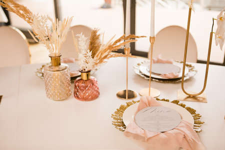 Table setting at a luxury wedding andの写真素材