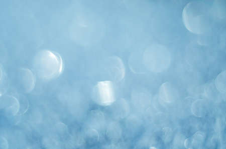 Abstract background with unfocused soft blue bokeh.の写真素材