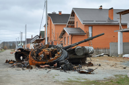 Dmytrivka village, Kyev region, Ukraine - April 13, 2022: Destroyed Russian tank following the Ukrainian forces counter-attacks. War of Russia against Ukraine.のeditorial素材