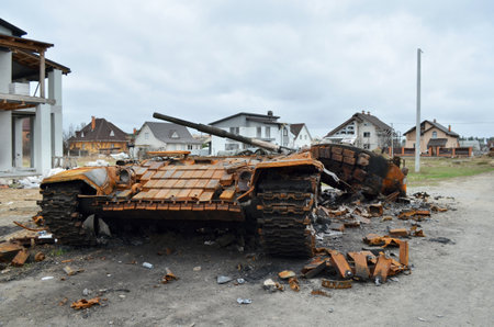 Dmytrivka village, Kyev region, Ukraine - April 13, 2022: Destroyed Russian tank following the Ukrainian forces counter-attacks. War of Russia against Ukraine.のeditorial素材