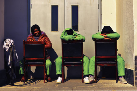 Workers taking rest at backstreetのeditorial素材