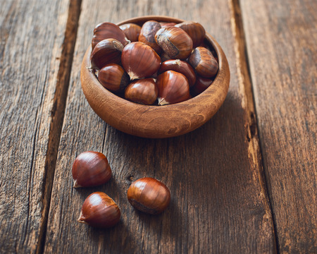 Chestnuts in wooden bowlの写真素材