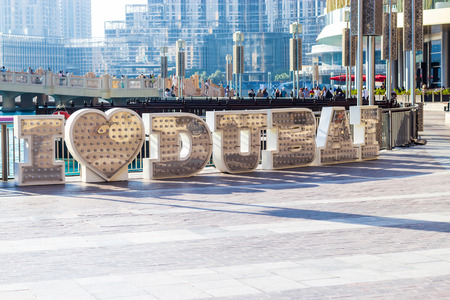 DUBAI, UAE - October 16, 2017: Large metallic LED letters. Inscriptionのeditorial素材