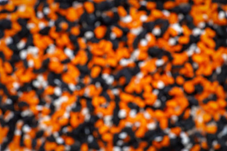 Lot of pumpkin, ghost, bat candies for  Halloween background. Motion blurred.の写真素材