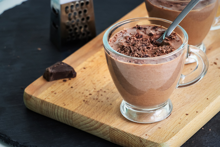 Healthy paleo chocolate yogurt dessert. Dark background.の写真素材