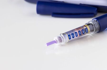 Insulin pen, syringe pen, glucometer. Isolate. White background. Medicine, diabetes, health and healthcare concept. Close up. Copy space.の写真素材