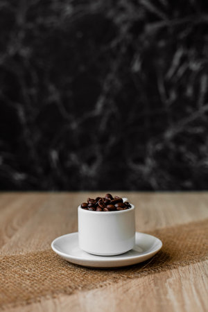 coffee beans in a white cup on the table