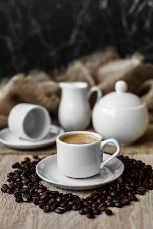 Espresso in a white cup, coffee beans, coffeeの写真素材