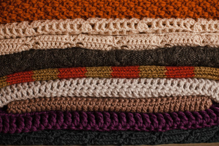 Knitted things. Tangles, knitting needles, and a hook. Background and place for the text.