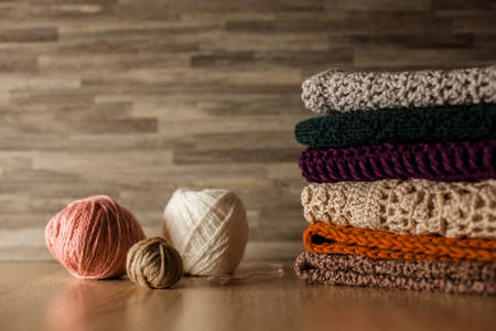 Knitted things. Tangles, knitting needles, and a hook. Background and place for the text.の写真素材