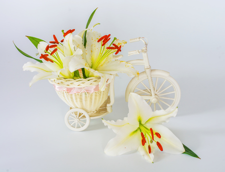 flowers lilies adorned with stones and different decorations. drops of waterの写真素材
