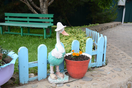 beautiful, well-kept grounds where there are different interesting figurines, beautiful trees, coniferous forest and garden.の写真素材