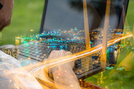 technology and communication, work at the keyboard with a laptop outdoors, technology developmentの写真素材