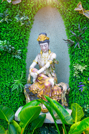 Buddhist temple decorated ceilings and walls statues of goddesses. inside the temple are beautiful murals and decorate the walls. Nanshan Park.の写真素材