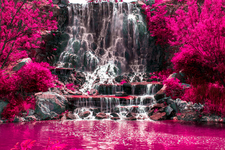 beautiful waterfall under sunlight, many beautiful water jets surrounded by green forests. travelの写真素材