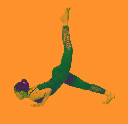 young girl performs different poses of yoga, flexible beautiful model on a white background....