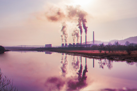 many large pipes of which goes dirty smoke, exhaust fumes and shepherds, above the city, the pollution of Wednesdayの写真素材