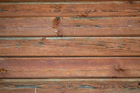 The surface of a wooden wall painted brown color. Old wood texture.の写真素材