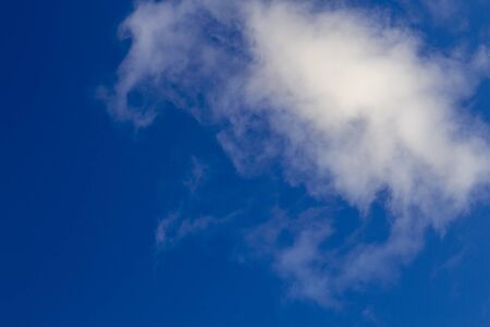 Bright white clouds on blue sky. Beautiful background.の写真素材