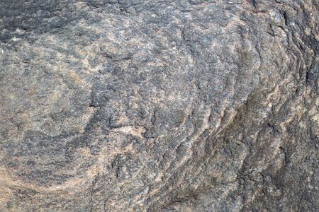Stone surface with a beautiful circular pattern. Natural granite texture.の写真素材