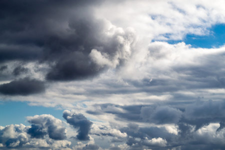 Clouds close up. Dark gray clouds at sunny day. Natural background.