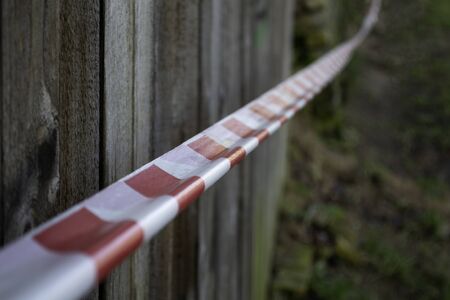 Do not cross line tape. Red and white caution line.の写真素材