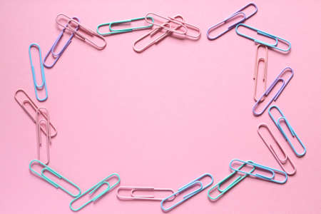 In a quarry with red clay, a yellow excavator with a large bucket.の写真素材