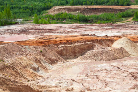 Clay quarry. The place of extraction of red clay for the production of bricks.の写真素材