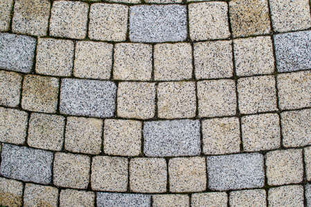 Pavers laid out in a semicircle. Paving squares and rectangles are laid out on the surfaceの写真素材