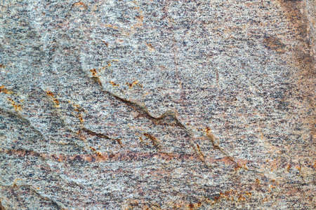 Brawn and gray stone texture. Rough granite surface pattern, natural mineral stone wall background. Copy space, place fot text.の写真素材
