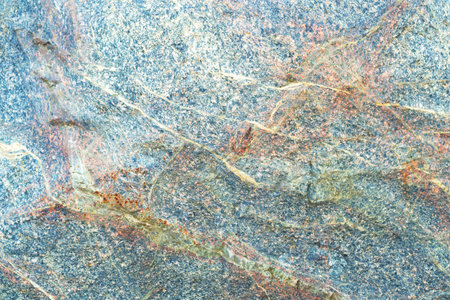 Line stone background. Dark blue and orange granite untreated surface. Natural texture. Copy space, place fot text.の写真素材