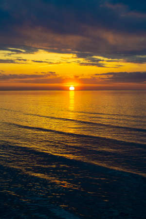 Beautiful colorful sunset over Baltic sea in Jurmala resort, Latvia. Relax, vacation concept. Warm summer evening on beach.の写真素材