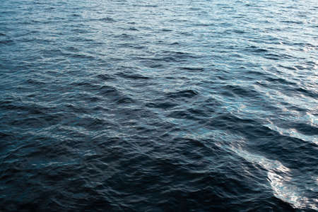 Ripple, many little wave. A lot of waves on lake surface. Water texture, natural spring - summer background. Sunny day in nature.の写真素材