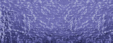 Very peri PANTONE colors of the year 2022. Banner with concrete blue - purple color painted wall. Bright background with grainy texture surface.の写真素材