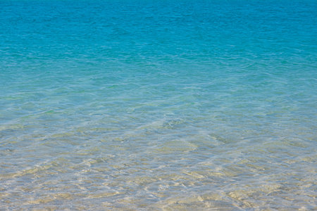 Red sea beach. Vivid, bright ripple sea surface. Aqua blue color water texture. Copy space, top...